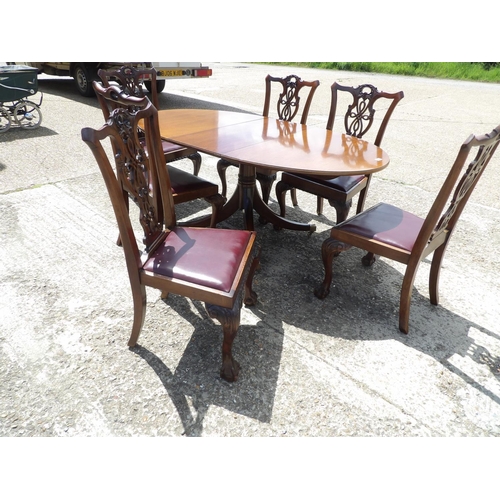 349 - A reproduction mahogany dining table together with mahogany chairs with drop in leather upholstered ... 