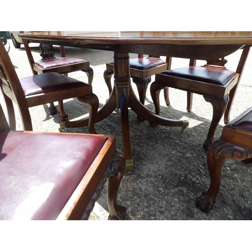 349 - A reproduction mahogany dining table together with mahogany chairs with drop in leather upholstered ... 