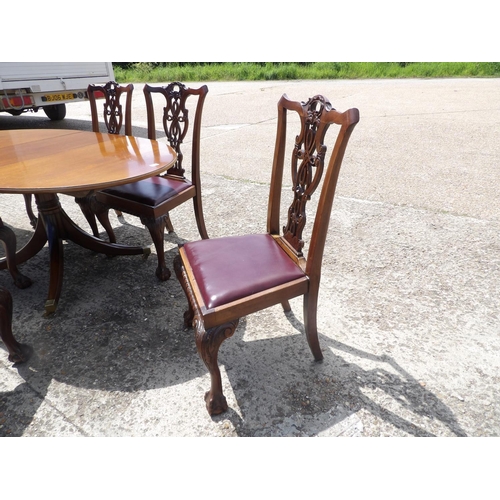 349 - A reproduction mahogany dining table together with mahogany chairs with drop in leather upholstered ... 