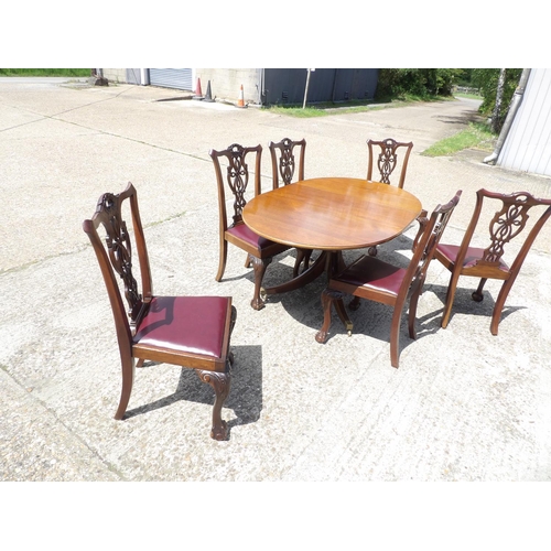 349 - A reproduction mahogany dining table together with mahogany chairs with drop in leather upholstered ... 