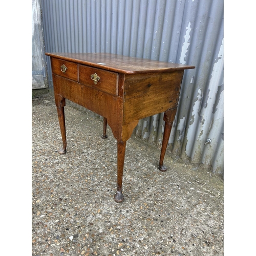 35 - An antique oak two drawer lowboy 77x50x70