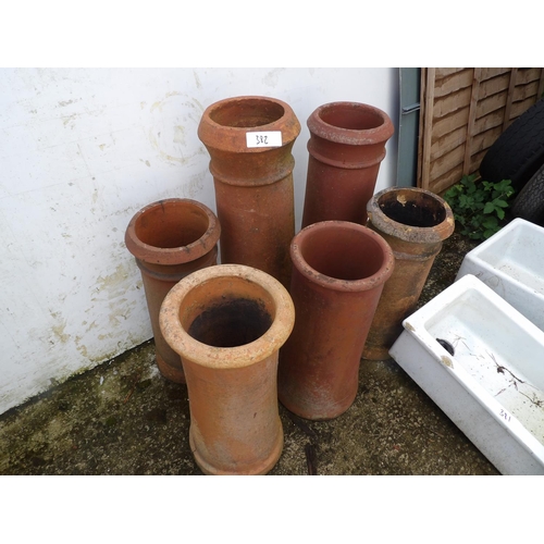 382 - A collection of six terracotta chimney pots tallest 85cm