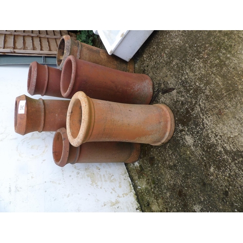 382 - A collection of six terracotta chimney pots tallest 85cm