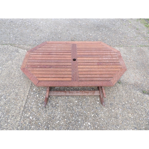 389 - A folding hardwood garden table