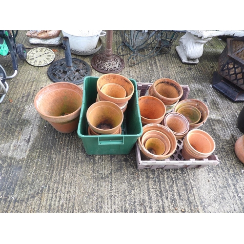 394 - Two large trays of terracotta garden pots