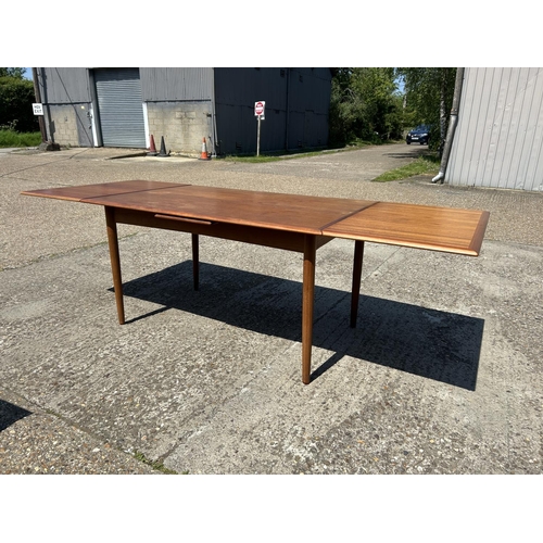 4 - A danish teak drawer leaf dining table MARKED ACO MOBLER by AXEL CHRISTENSEN 138x93x75 (closed)