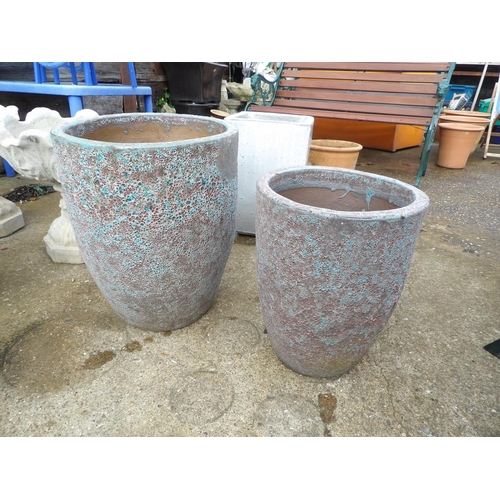 410u - A large and small pair of lava pattern urns