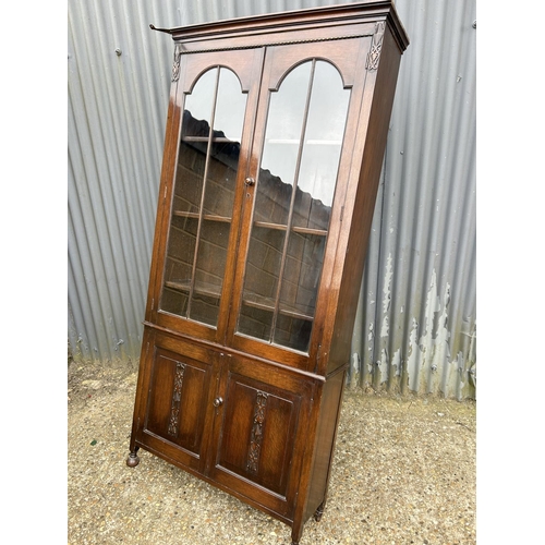 48 - A early 20th century glazed oak bookcase 92x27x125