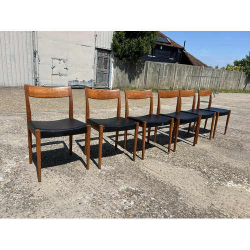 5 - A set of six danish teak dining chairs marked TROEDS MADE IN DENMARK with black vinyl seats (on chai... 