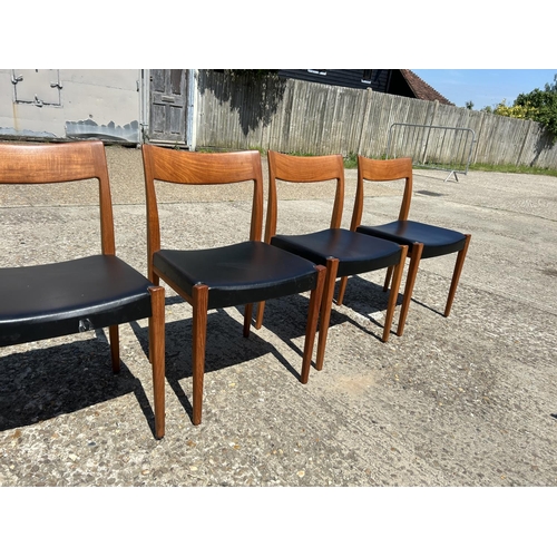 5 - A set of six danish teak dining chairs marked TROEDS MADE IN DENMARK with black vinyl seats (on chai... 