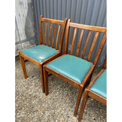 52 - A set of four 1920's oak dining chairs