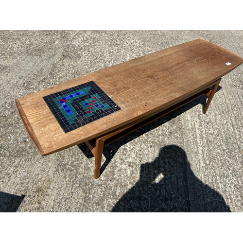 7 - A danish teak coffee table marked with Danish quality control label 150x48x43