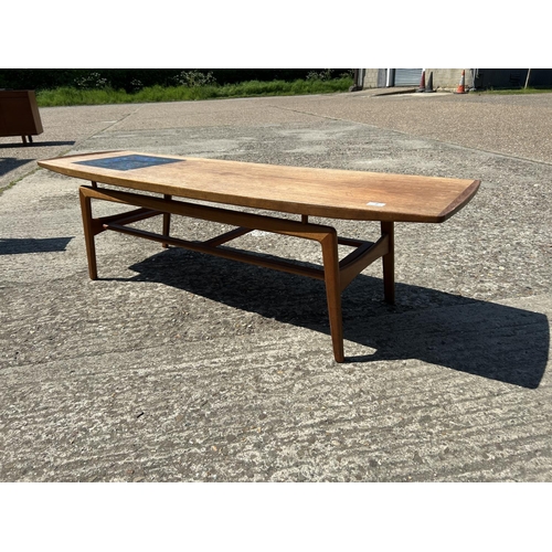 7 - A danish teak coffee table marked with Danish quality control label 150x48x43