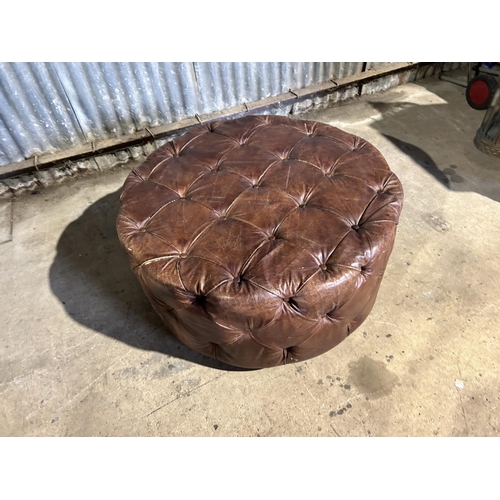 72 - A circular tan brown leather revolving chesterfield stool 100cm diameter