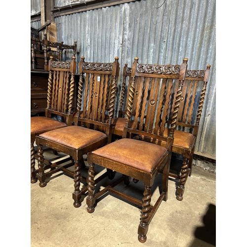 76 - A set of six carved oak and barley twist dining  chairs with drop in tan brown leather seats