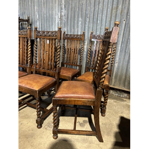 76 - A set of six carved oak and barley twist dining  chairs with drop in tan brown leather seats