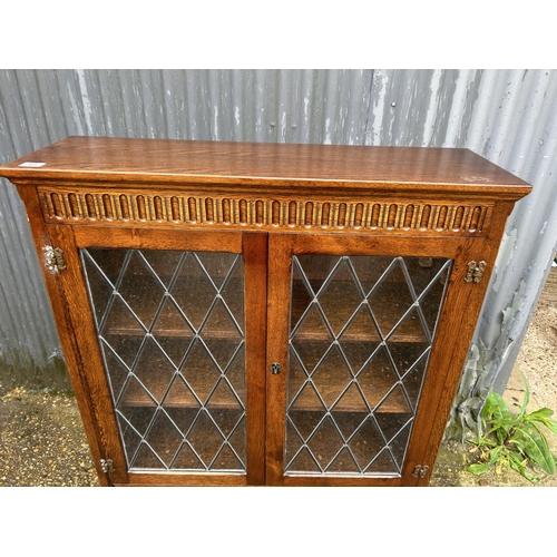 81 - A old charm leaded oak bookcase 97x30x140