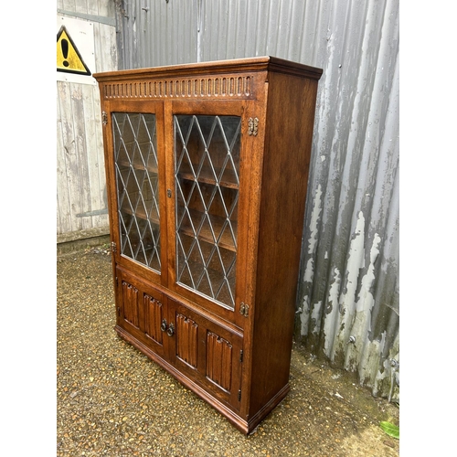 81 - A old charm leaded oak bookcase 97x30x140