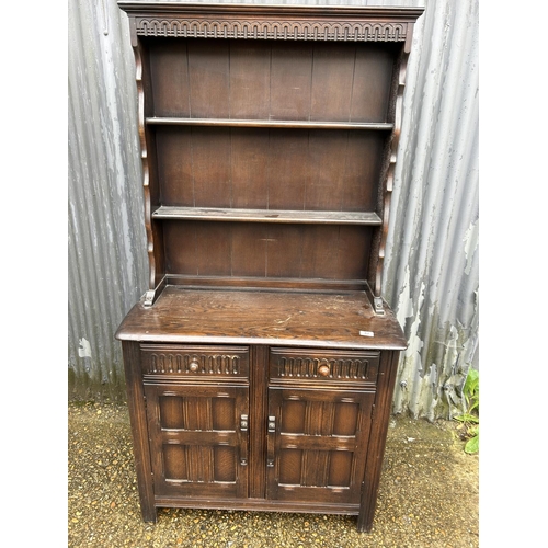 82 - A dark ercol,cottage dresser 95 cm wide