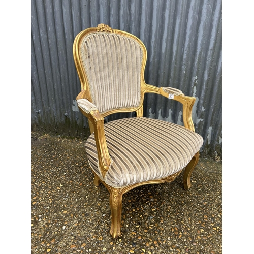 83 - A gold gilt framed throne style chair