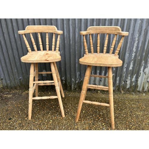 85 - A pair of pine bar stools