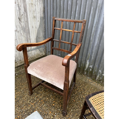 89 - An oak carver chair, oak framed footstool and another chair