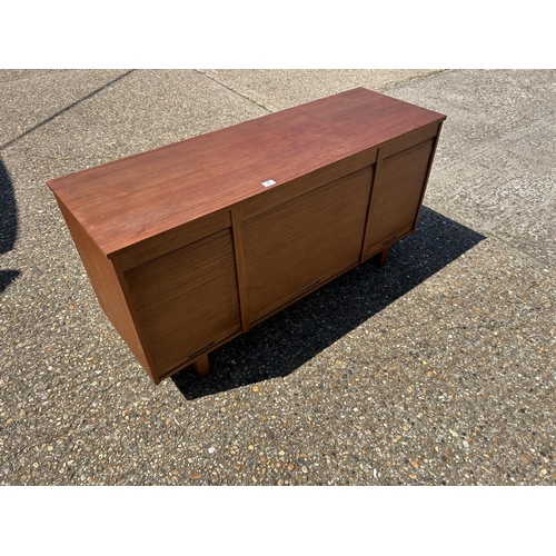 9 - A mid century teak triple tambour sideboard  137x45x70