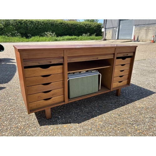 9 - A mid century teak triple tambour sideboard  137x45x70