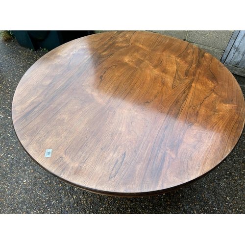 90 - A Victorian rosewood circular tilt top breakfast table 130 cm diameter