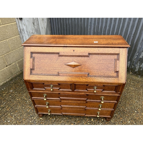 91 - A large solid oak bureau 107x 46  x5