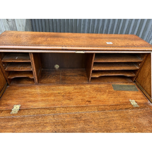 91 - A large solid oak bureau 107x 46  x5