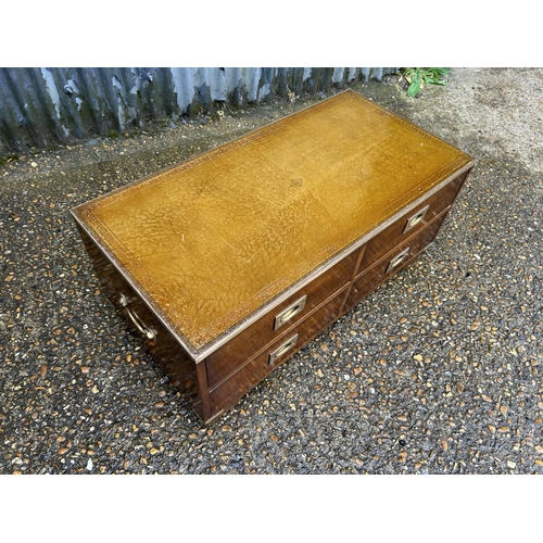 92 - A military style reprodux leather top four drawer coffee table chest 97x 42x40