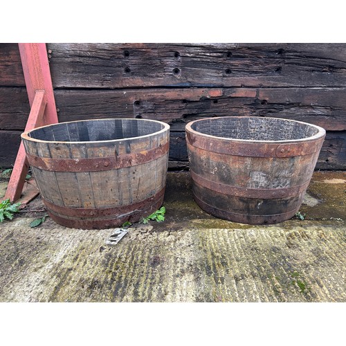 278 - A pair of scotish oak half wiskey barrel planters 2ft round