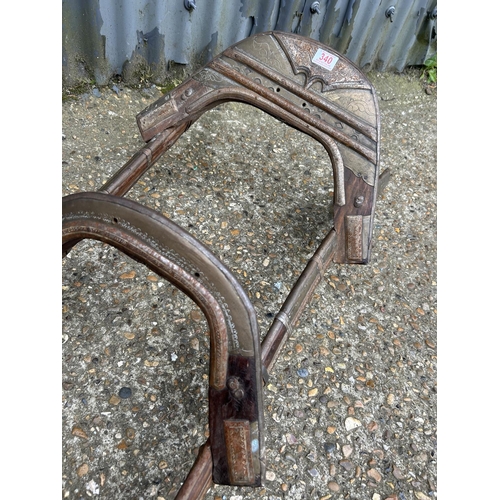 47 - An eastern antique brass mounted camel saddle