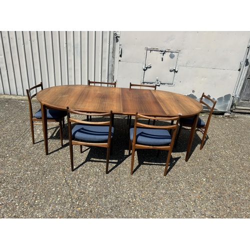 61 - A danish rosewood extending dining table by ROSENGREN HANSEN together with a set of six matching ros... 