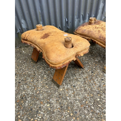 103 - A pair of leather top camel stools
