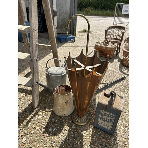 111 - A wooden step ladder, two water cans , umbrella stand, jug and esso can