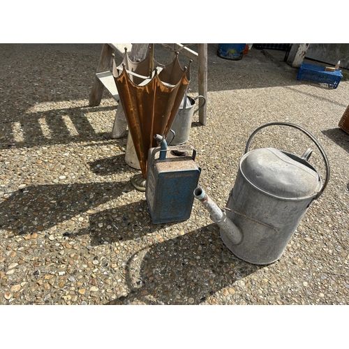 111 - A wooden step ladder, two water cans , umbrella stand, jug and esso can
