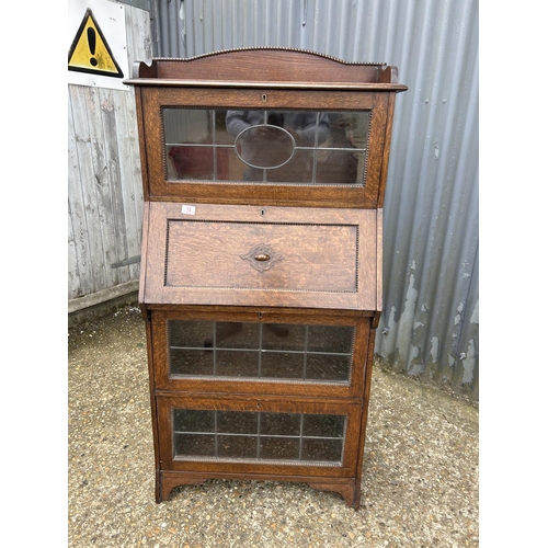 12 - A early 20th century oak bureau bookcase with leaded glass doors 72x32x144