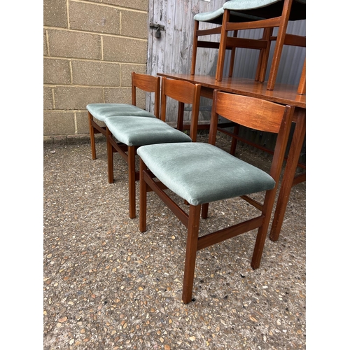 136 - A mid century teak refectory style dining table by ARCHIE SHINE 190x80x72 together with a set of six... 
