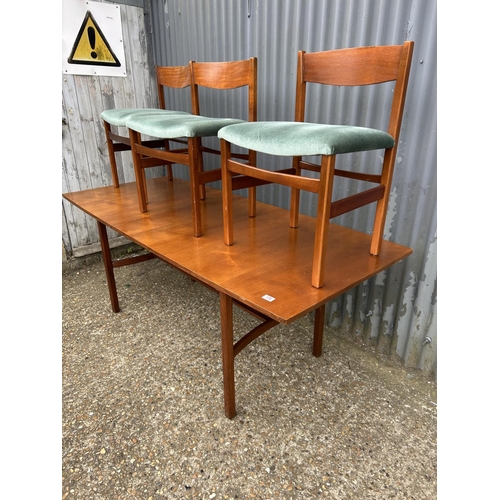 136 - A mid century teak refectory style dining table by ARCHIE SHINE 190x80x72 together with a set of six... 