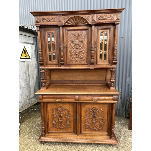14 - A large Dutch carved oak bookcase cupboard  140x50x220