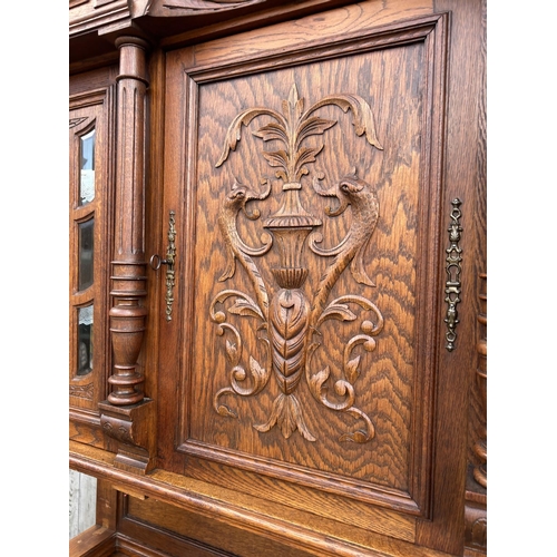 14 - A large Dutch carved oak bookcase cupboard  140x50x220