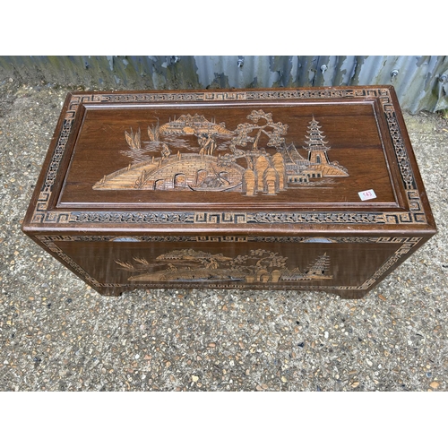 143 - An oriental camphor wood blanket box 102x50x55