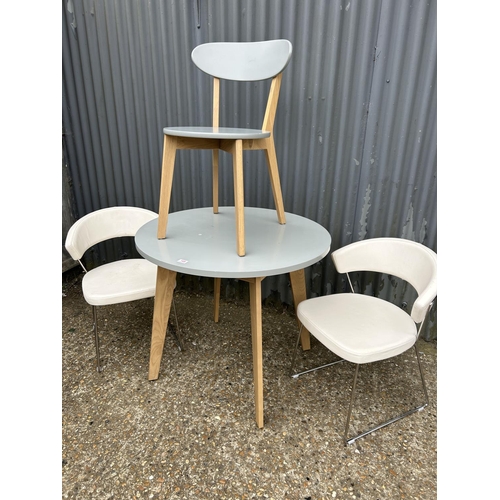 149 - A modern grey painted kitchen table 90cm diameter together with one grey chair and two modern chrome... 