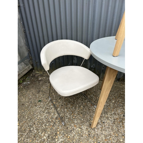 149 - A modern grey painted kitchen table 90cm diameter together with one grey chair and two modern chrome... 