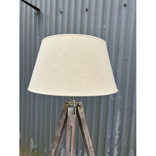 169 - A modern tripod floor lamp