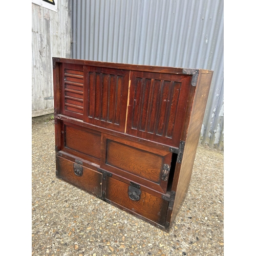 170 - An Oriental double sided sideboard with drawers and sliding doors to each side  88x44x90