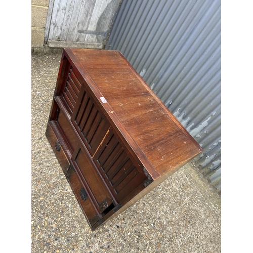 170 - An Oriental double sided sideboard with drawers and sliding doors to each side  88x44x90