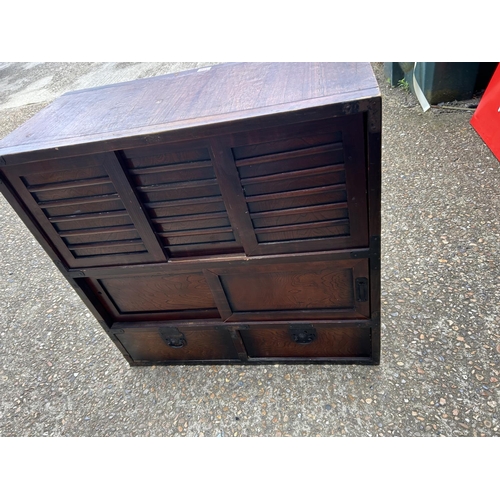 170 - An Oriental double sided sideboard with drawers and sliding doors to each side  88x44x90